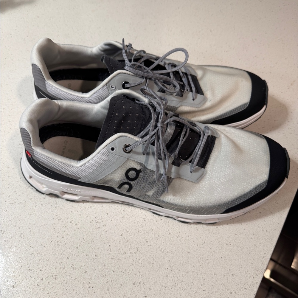 On Running Gray and Black Athletic Shoes with Cushioned Design